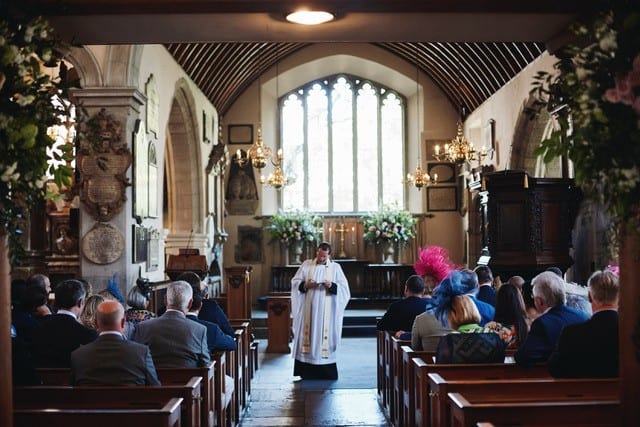 vicar conducting a service in church