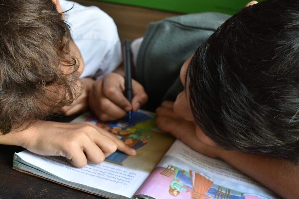 Two children with a religious book