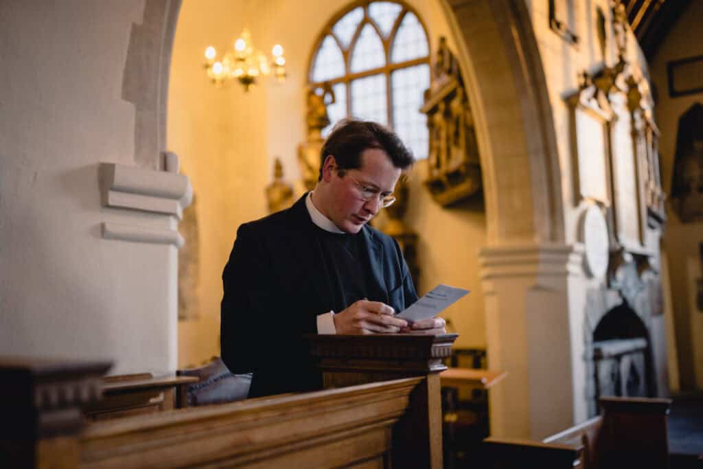 Max preparing for the service in the church