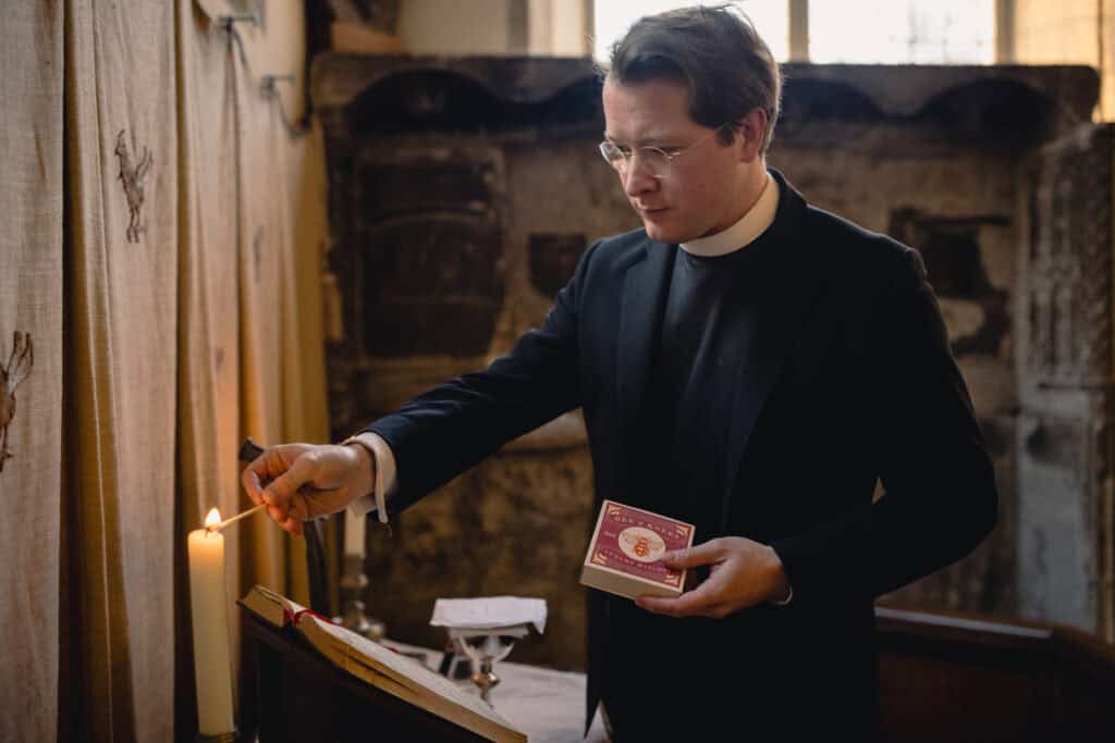 Max lighting a candle