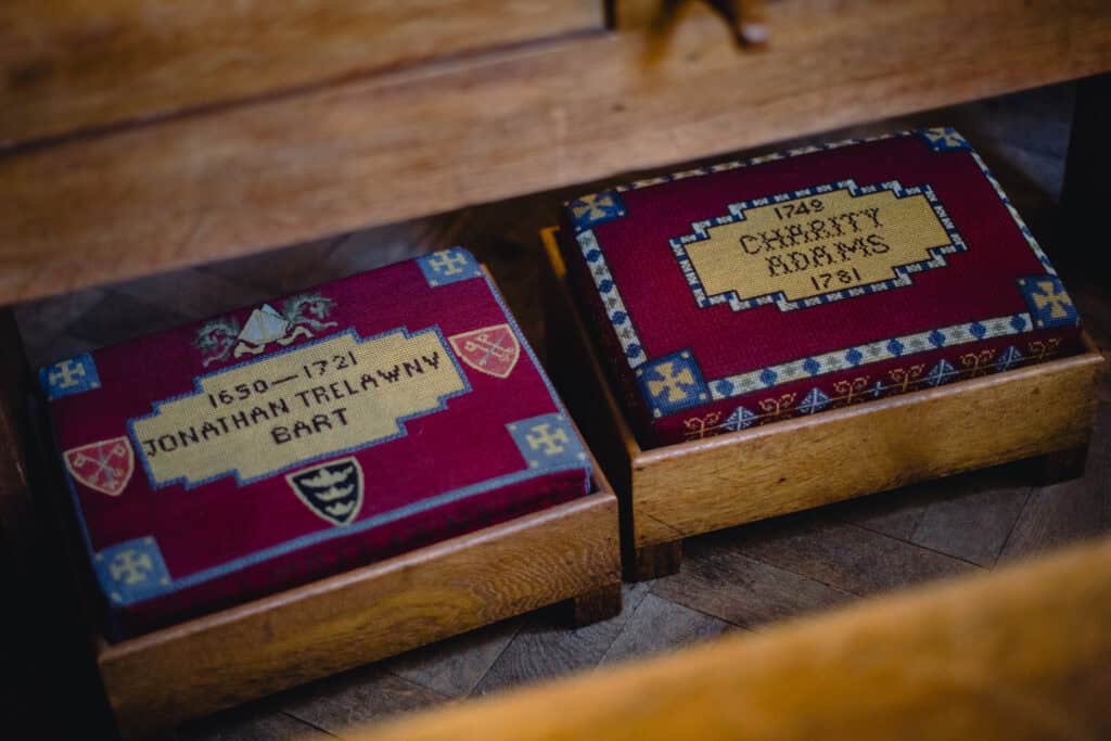 Kneelers (cushions to kneel on) with the names and dates of people embroidered on them