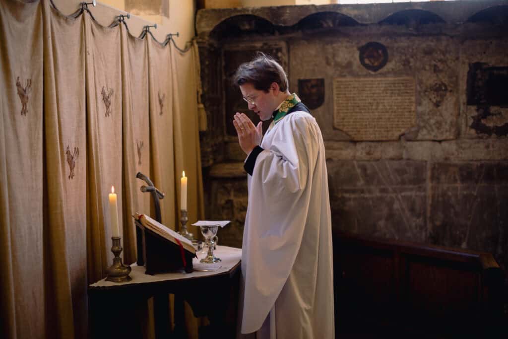 Max praying in the church