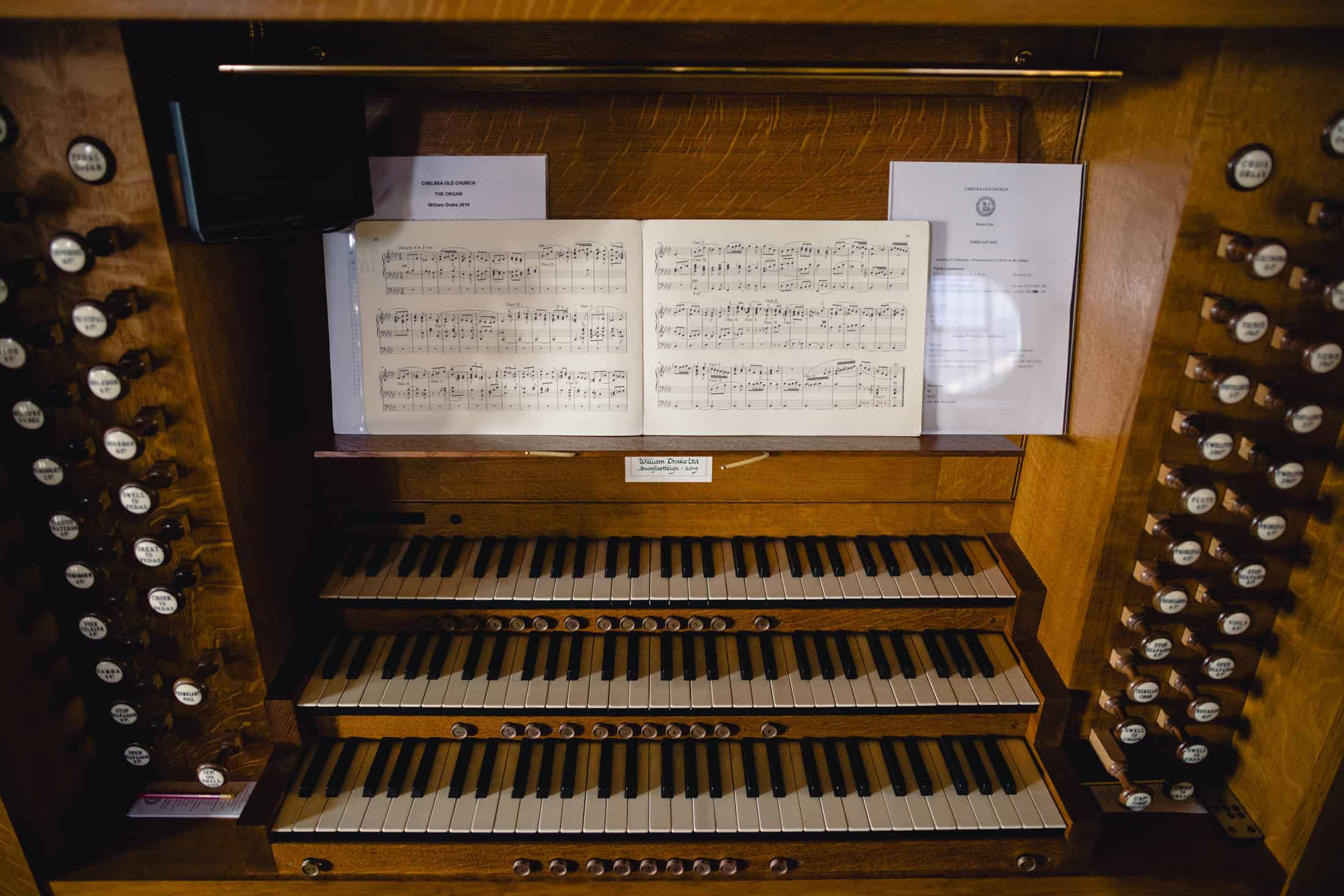 Chelsea Old Church organ, showing all the keys and stops, with sheet music